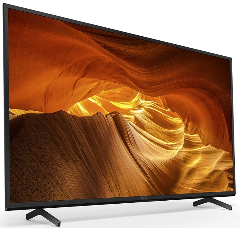 Czarny telewizor na stojaku, z widokiem na kanion. Telewizor jest pochylony, pokazując ekran.