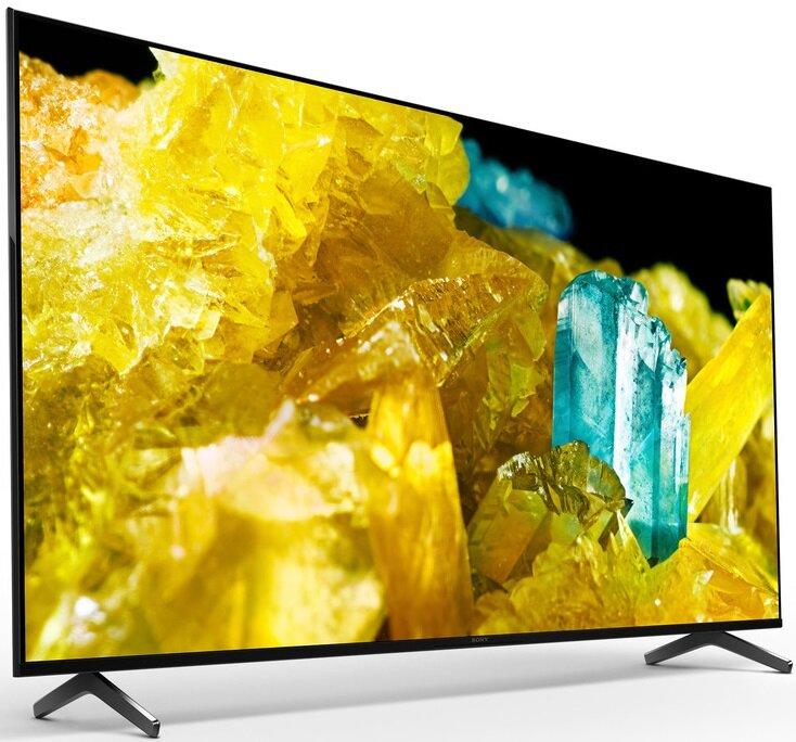 Ekran telewizora wyświetlający żółte i niebieskie kryształy.