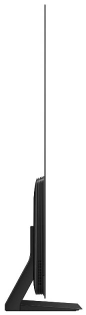 Widok z boku czarnego telewizora, z cienką ramką i podstawą. Jest na białym tle.