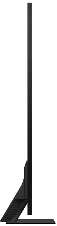 Widok z boku czarnego telewizora z płaskim ekranem na stojaku. Ekran jest duży i cienki.