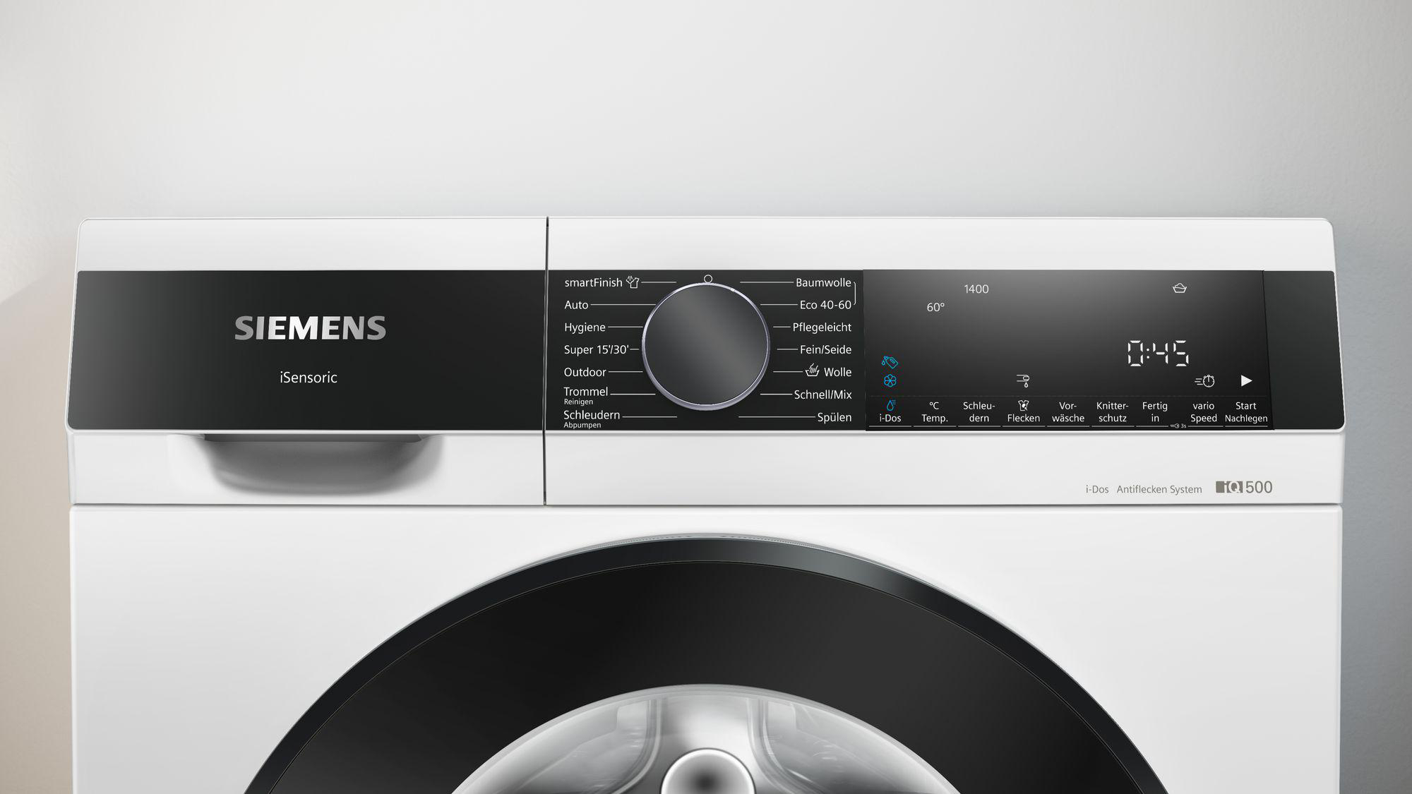 Weiße Siemens Waschmaschine mit Bedienfeld. Funktionen: Waschzyklen, Temperatur und Digitalanzeige mit Uhrzeit.