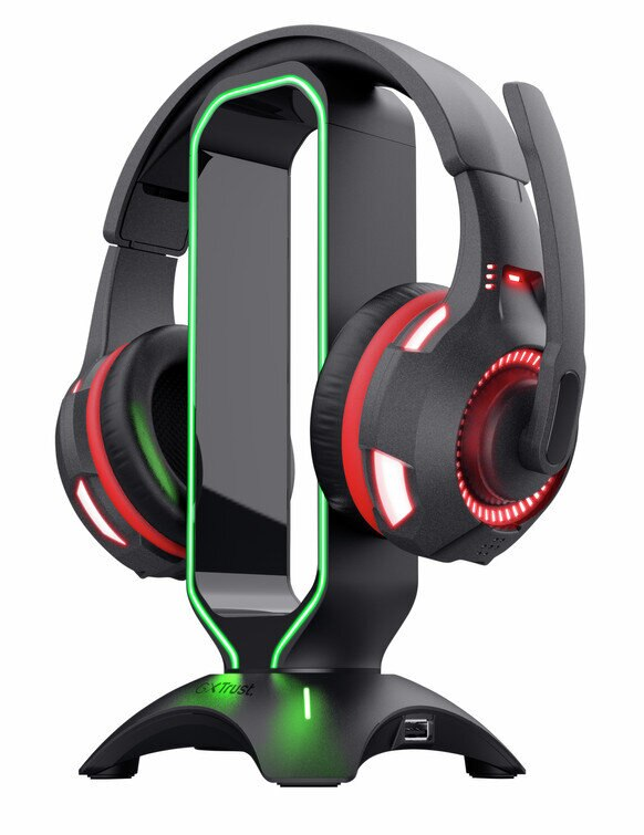 Czarne słuchawki dla graczy na stojaku z zielonym i czerwonym oświetleniem. Port USB w podstawie.