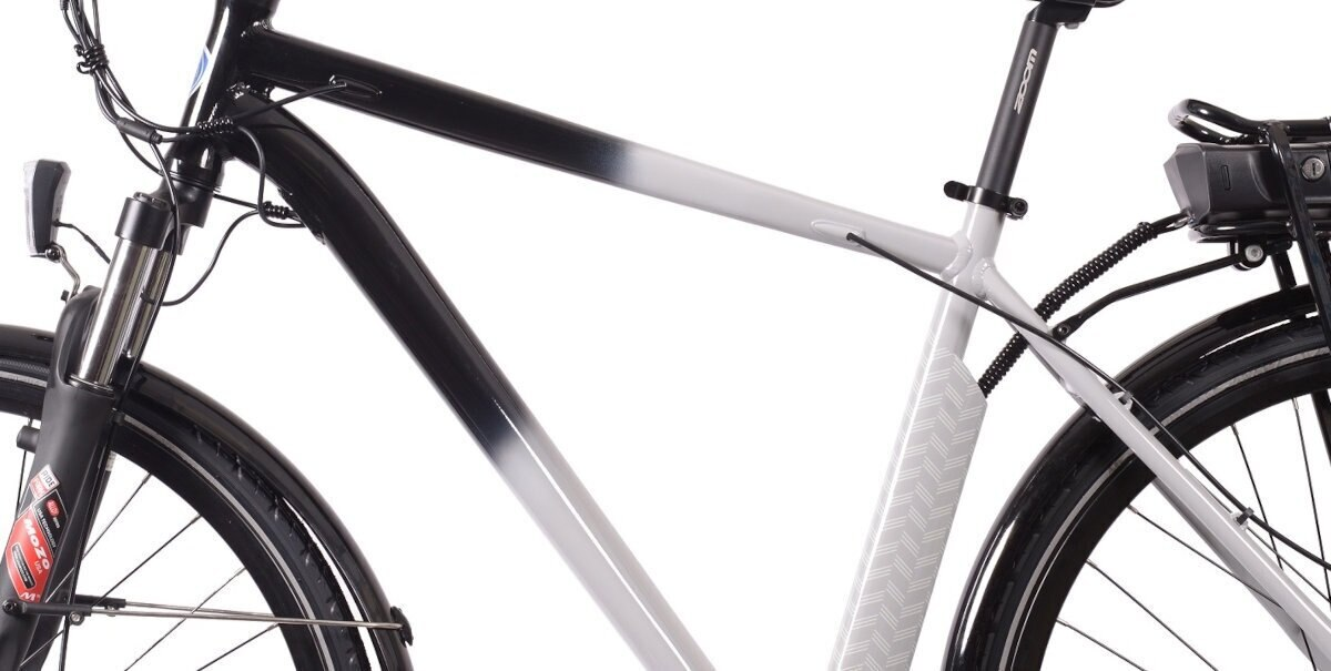 Czarno-biała rama roweru z oponami. Rower jest częściowo widoczny.