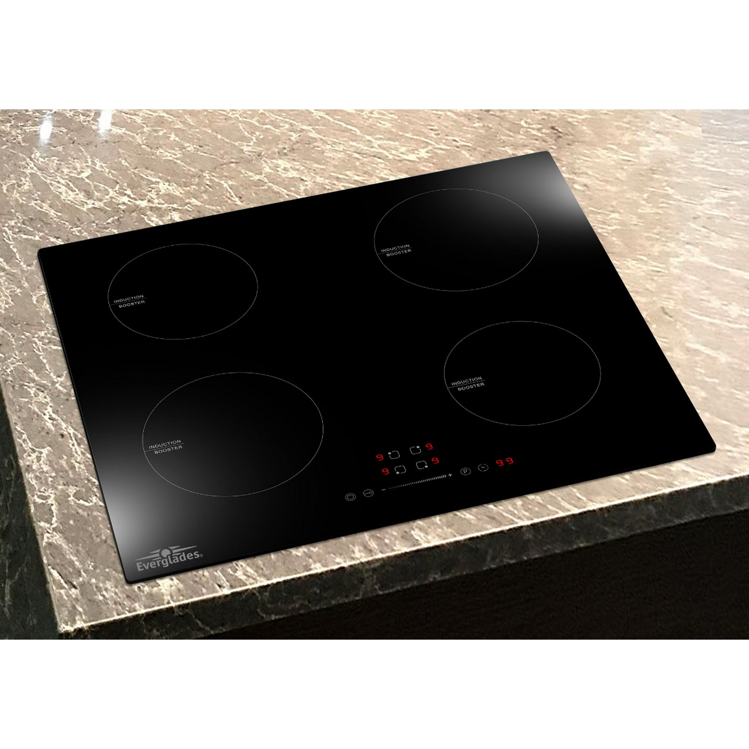 A black induction cooktop with four circular burners on a granite countertop.