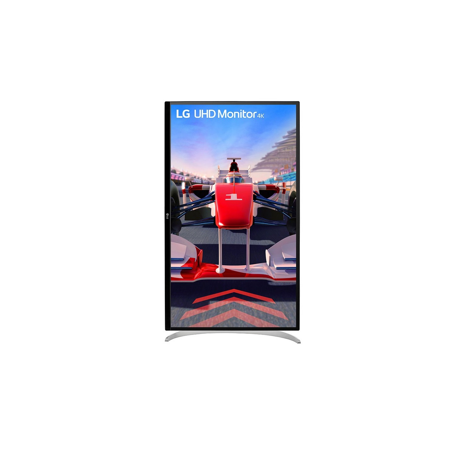 Le moniteur LG UHD affiche une voiture de course sur une piste. La voiture est rouge, blanche et noire. Le ciel est bleu.