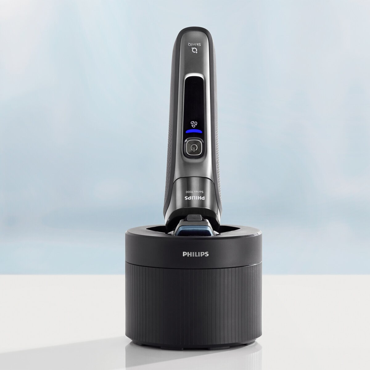 Czarno-szara golarka Philips na stacji ładującej.