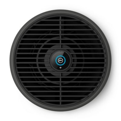 Un purificateur d'air noir de forme ronde avec une grille sur le dessus.