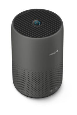 Un purificateur d'air noir cylindrique avec une base perforée et une grille supérieure.