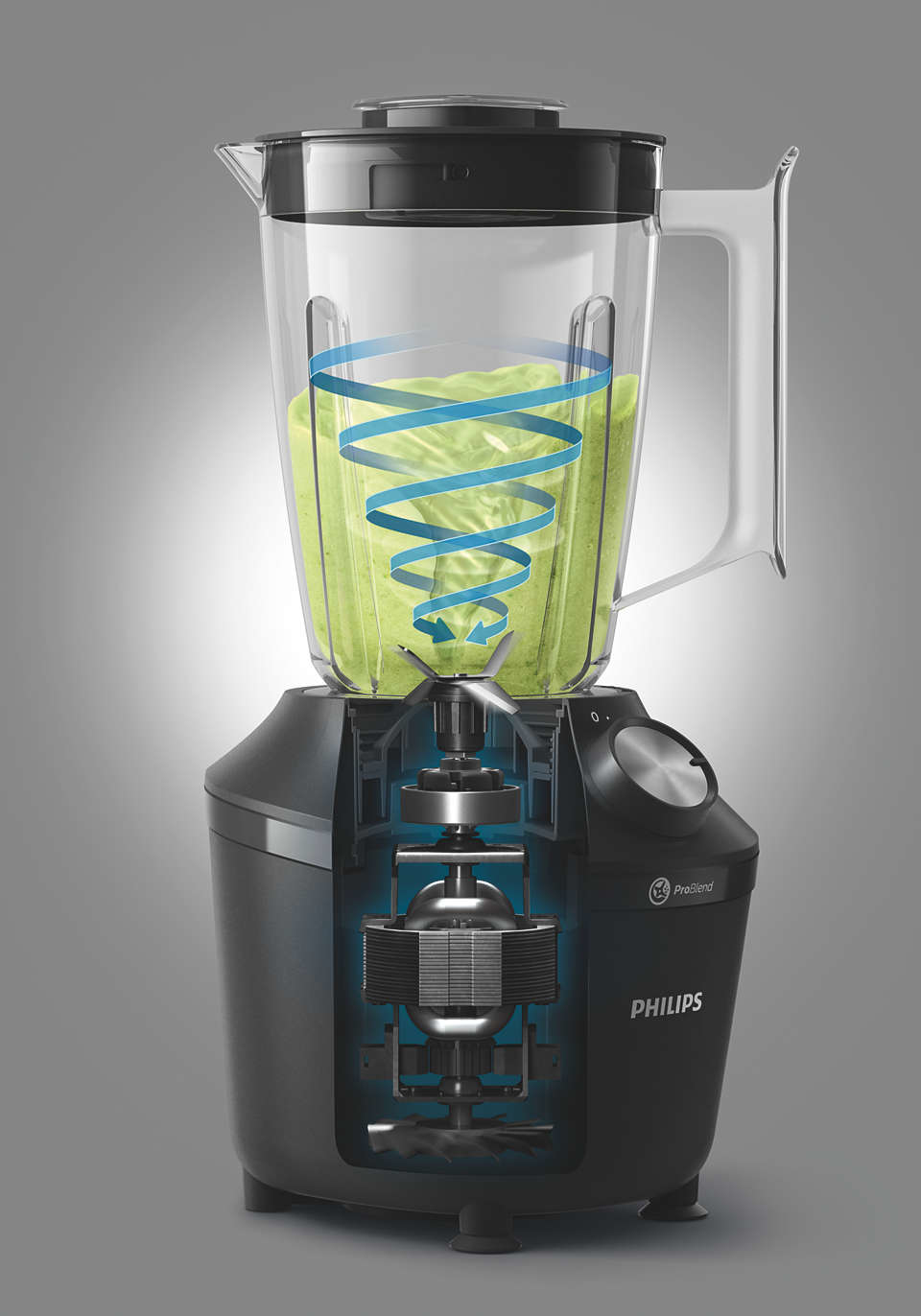 Blender with green contents, cutaway view showing internal components and a blue swirl.