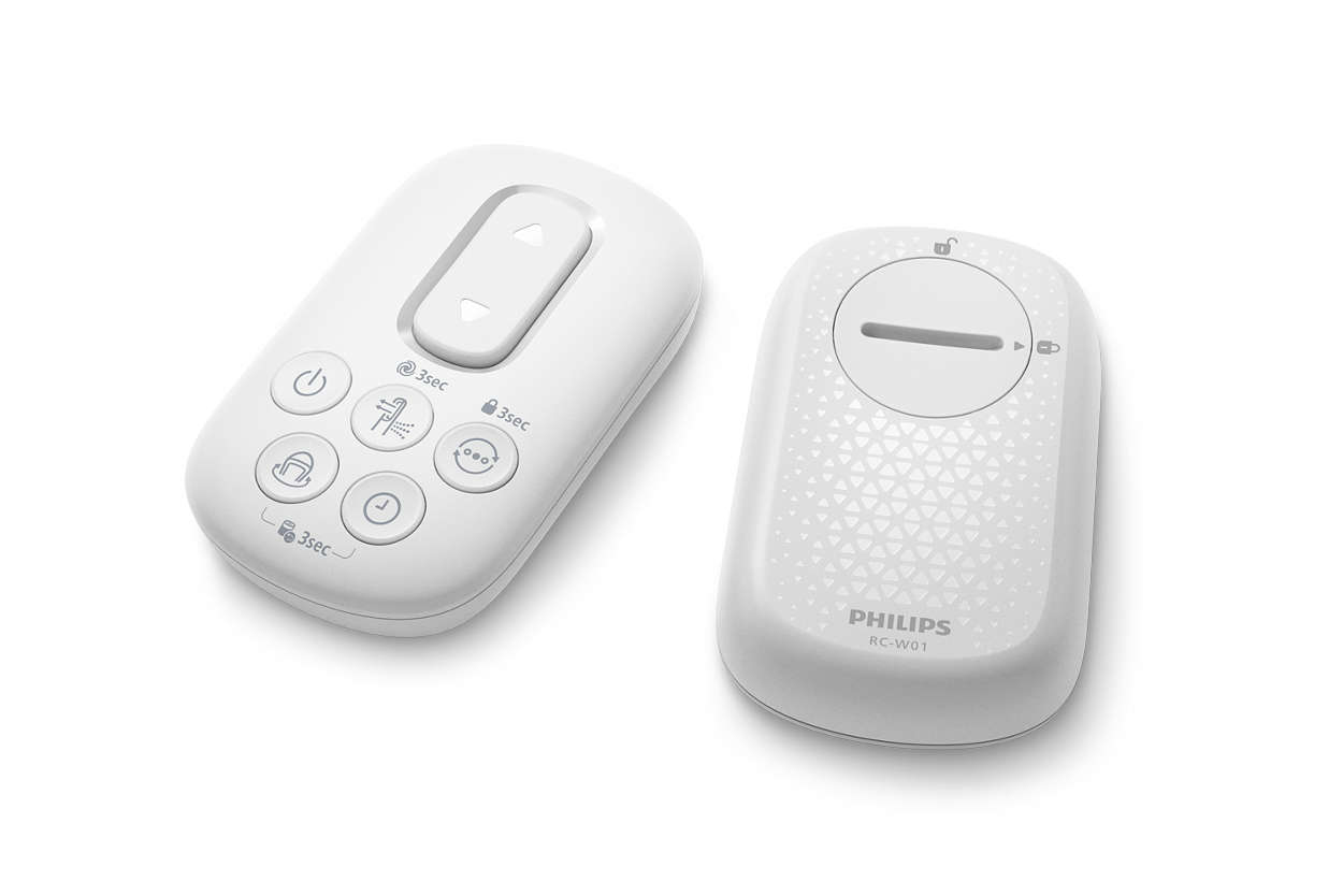 Two white Philips remote controls with buttons and a dial.