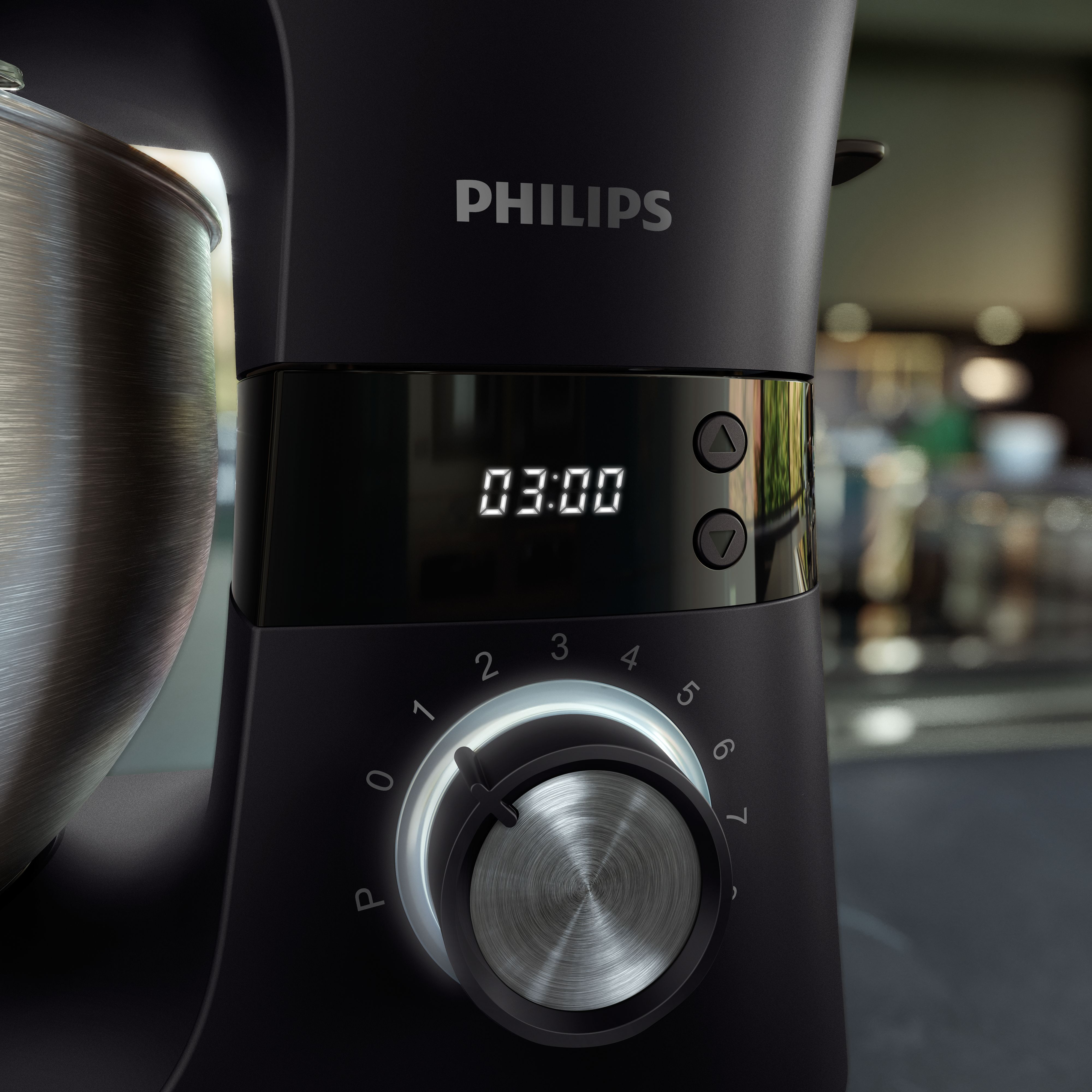 Black Philips stand mixer with a silver bowl. Display shows 03:00.