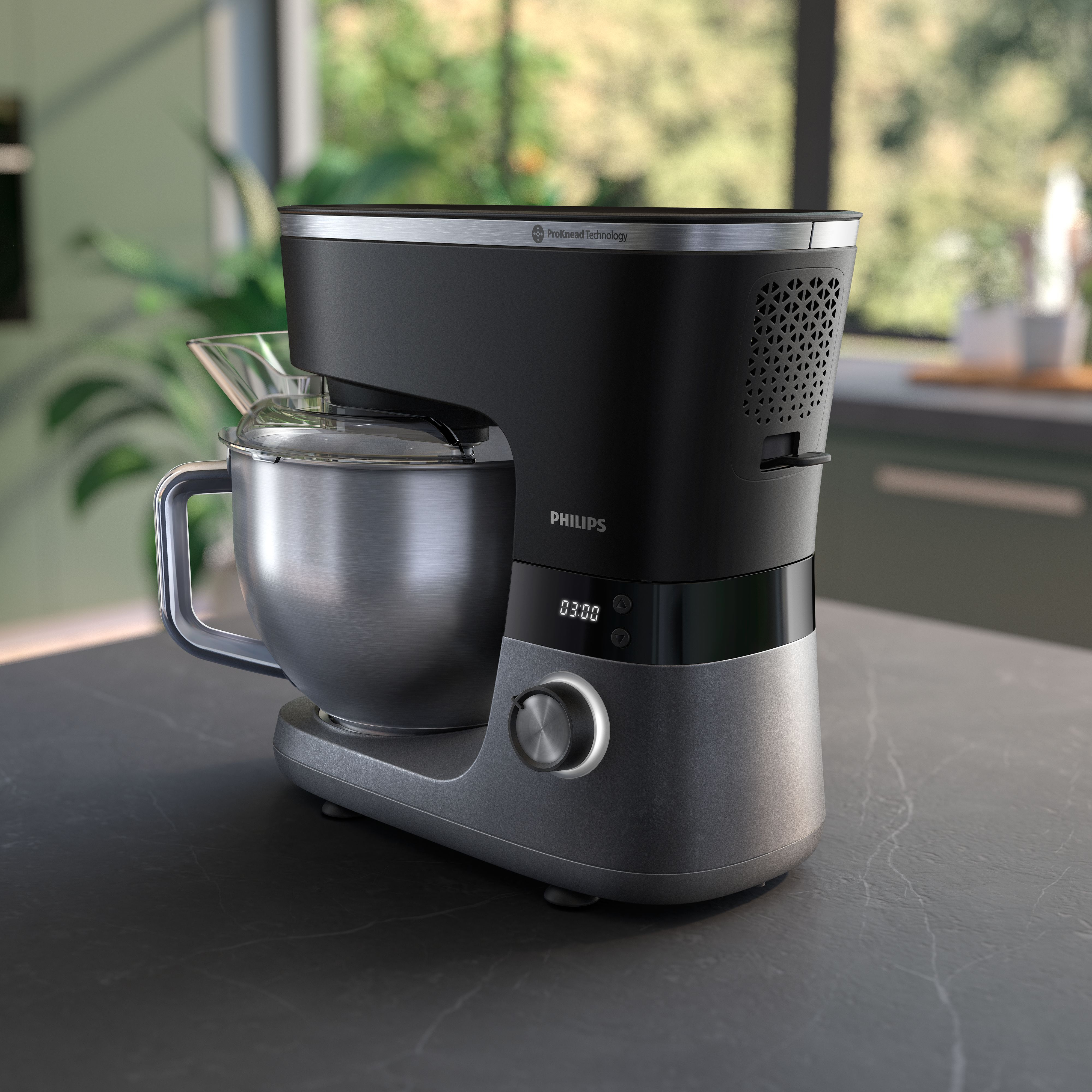 Kitchen appliance, black and silver, on a countertop.