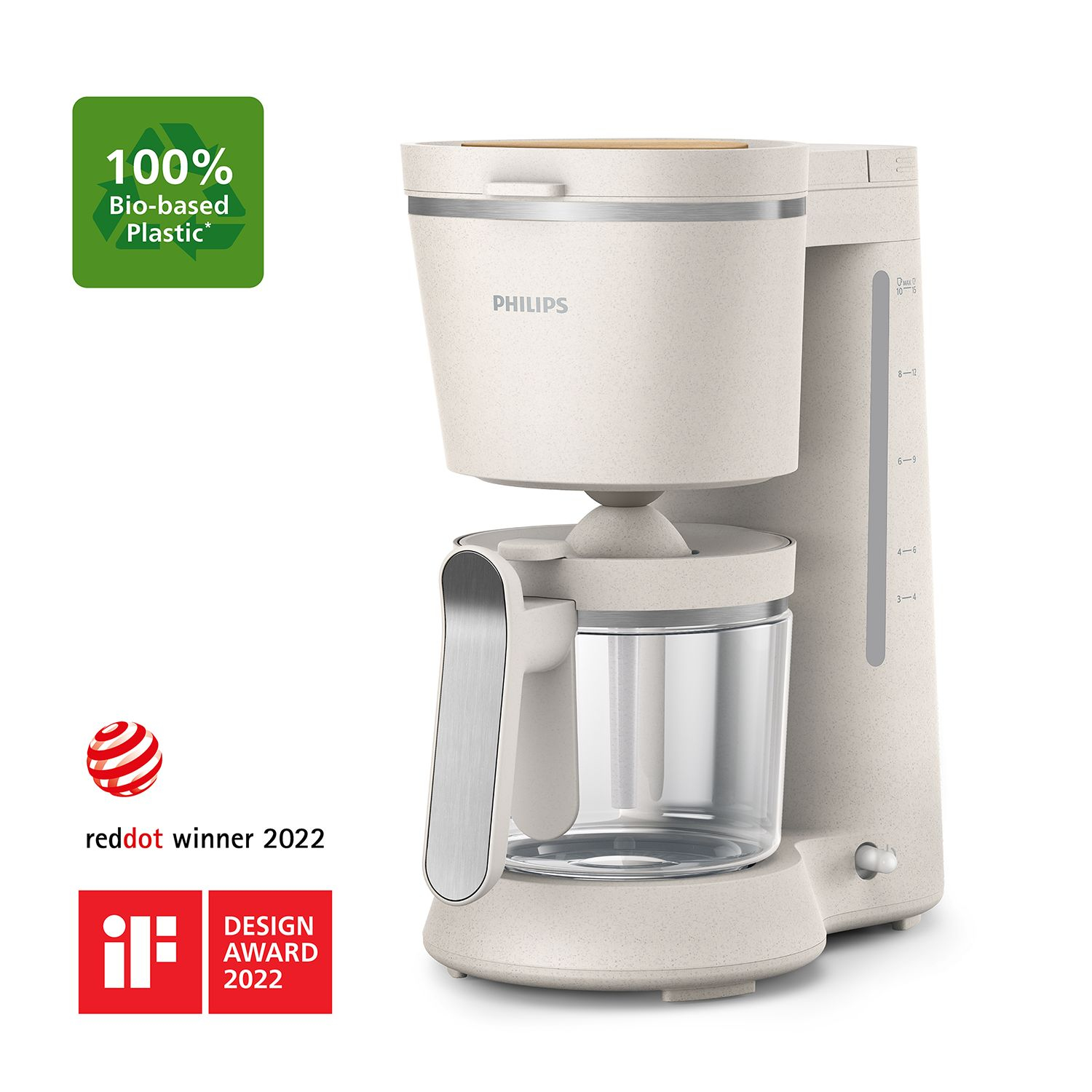 Cream-colored coffee maker with eco-friendly labels and design awards.