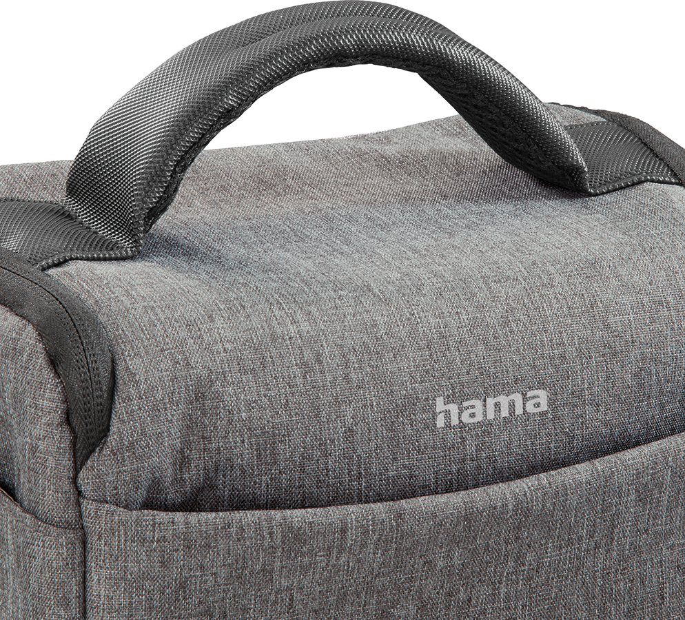 Gray camera bag with a handle. Hama logo visible. Close-up shot of the bag.