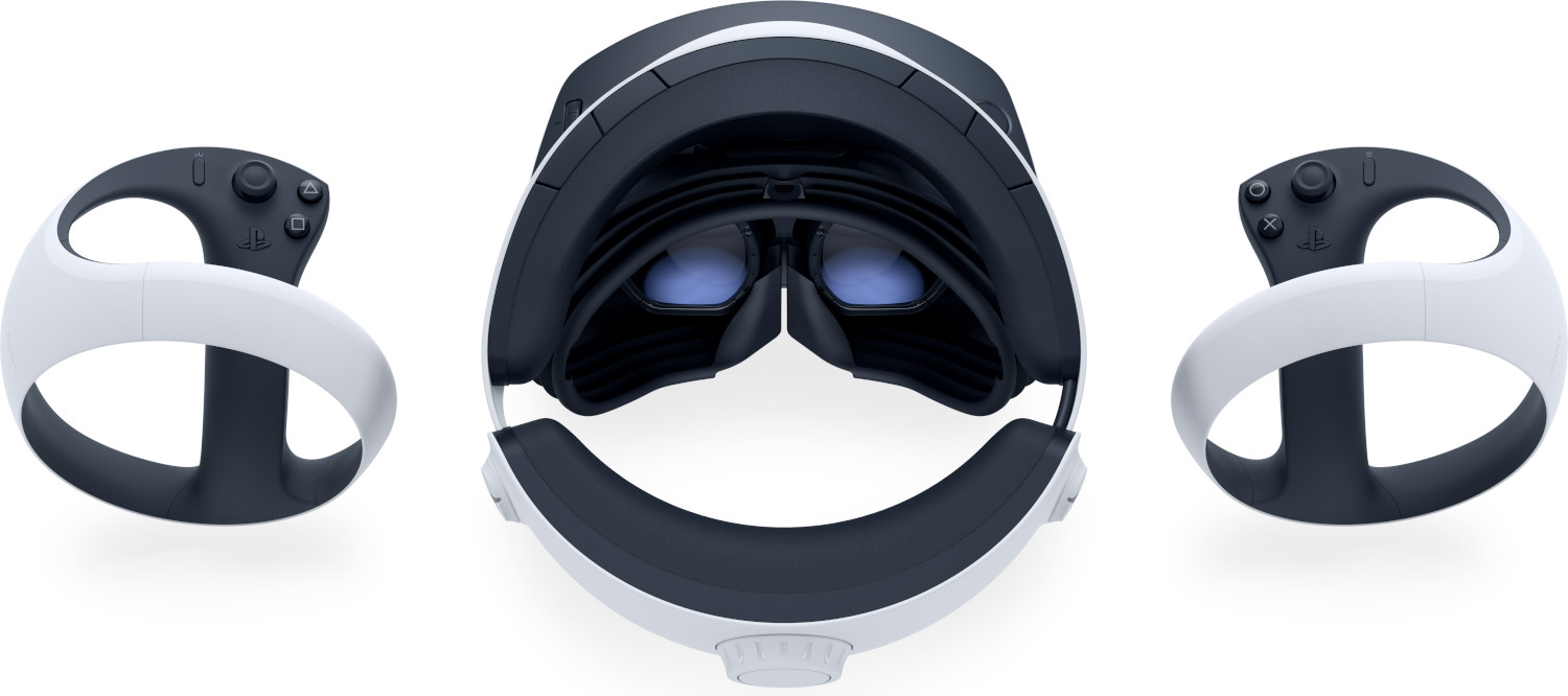 VR headset and controllers, white and black, top view.