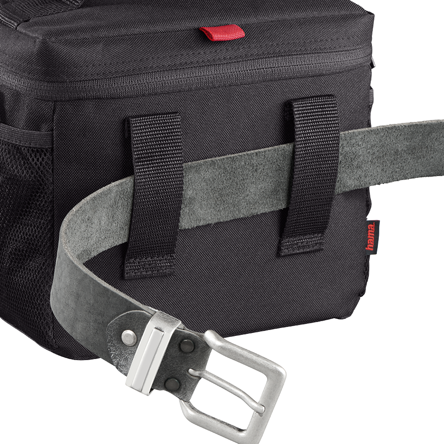 Black camera bag with a gray belt next to it on a white background.