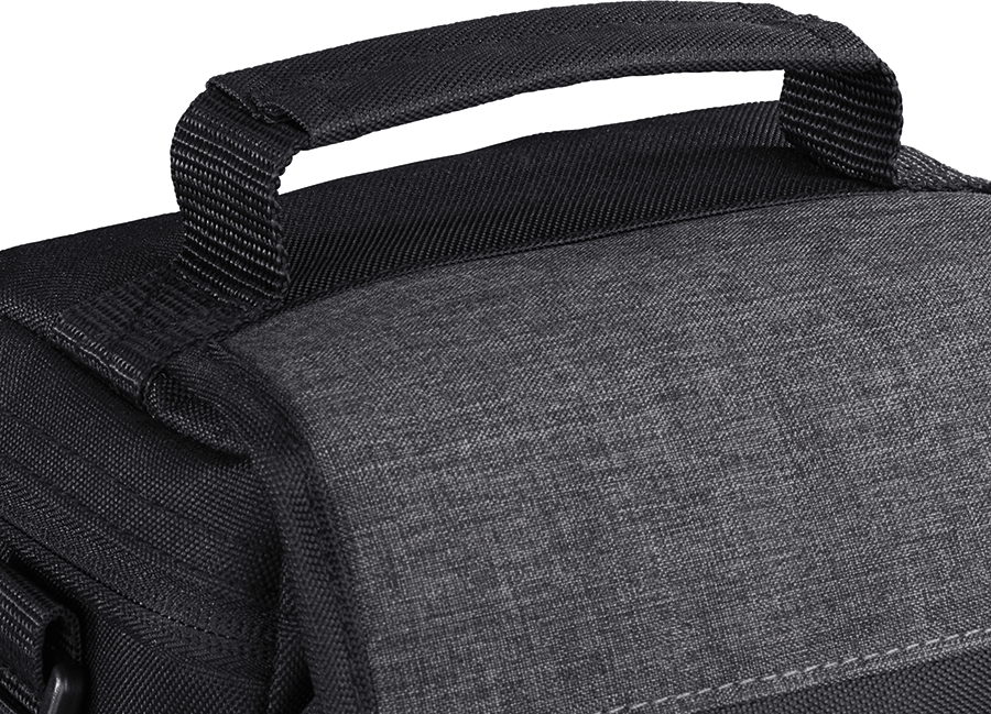 Close-up of a black bag handle. The bag appears to be made of textured, dark gray material.