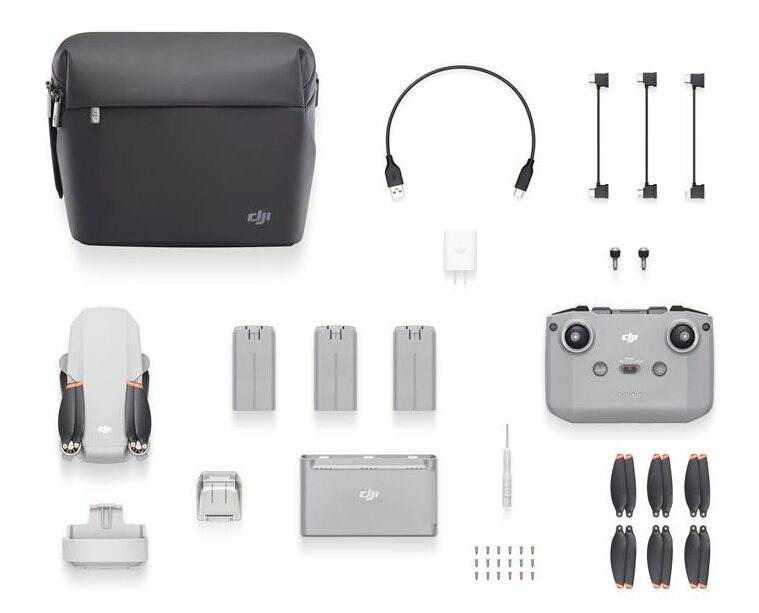 Zestaw drona DJI Mini z akcesoriami: torba, kontroler, baterie, ładowarka, śmigła.