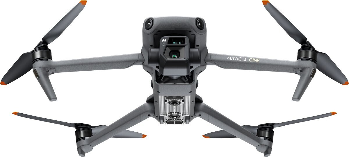 Dron z czterema śmigłami, kamerą i podwoziem. Szary korpus, czarne śmigła.