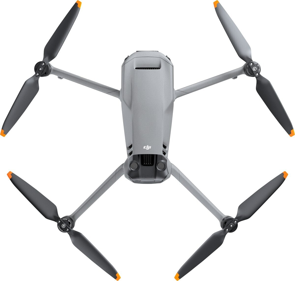 Szary dron DJI z czterema czarnymi śmigłami z pomarańczowymi końcówkami, widok z góry.