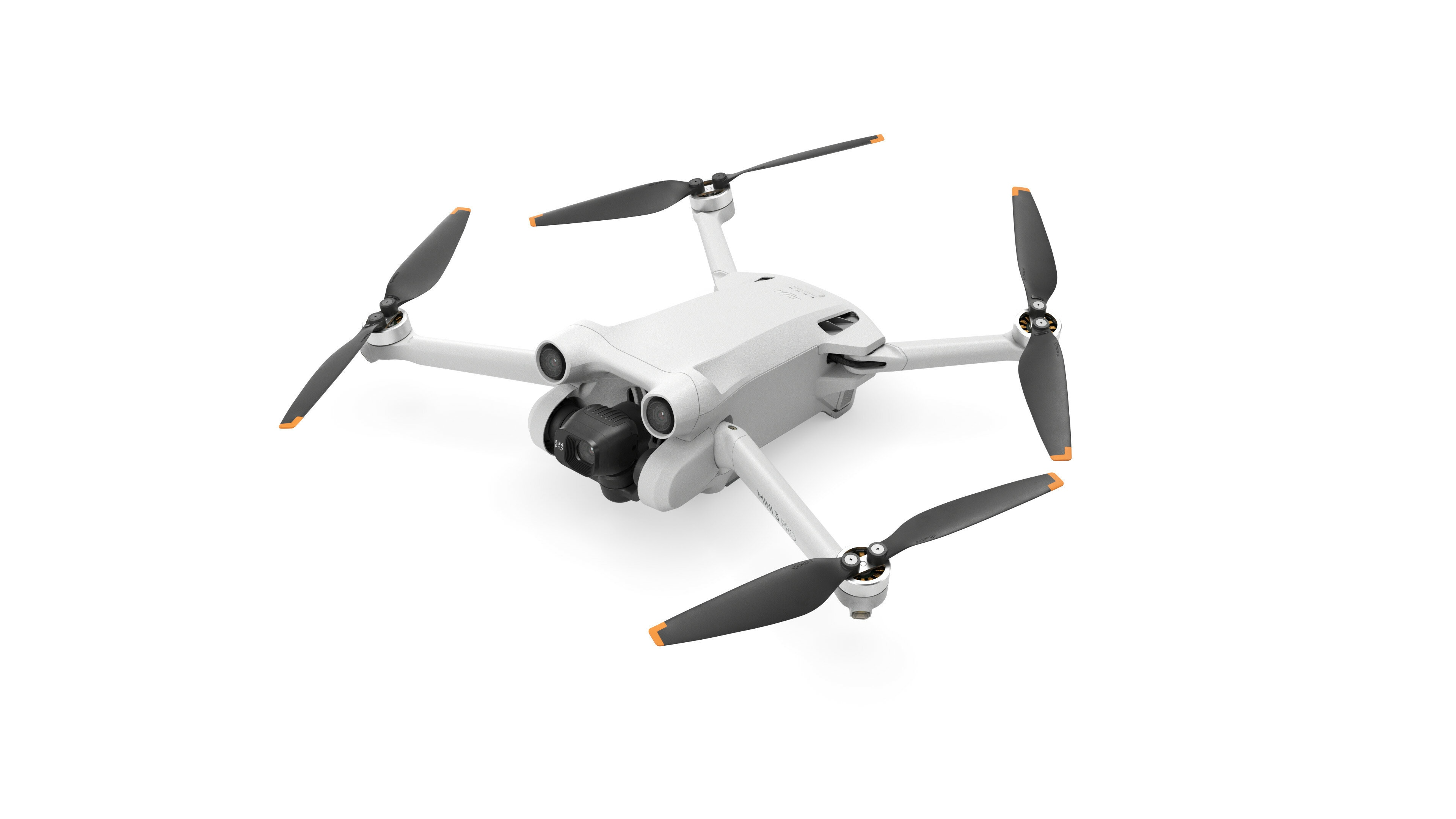 Biały dron z pilotem. Czarne tło. Pomarańczowe akcenty na śmigłach.