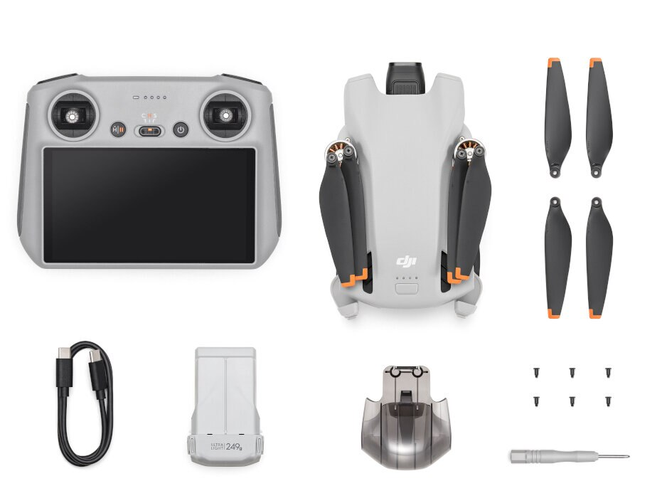 Dron DJI Mini 3 Pro i akcesoria ułożone na białym tle.