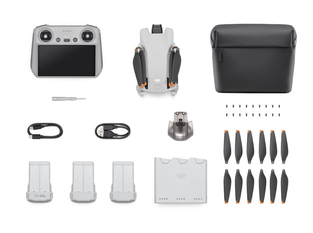 Zestaw drona DJI Mini 3 Pro. Zawiera drona, pilota, baterie, ładowarkę i futerał. Białe tło.