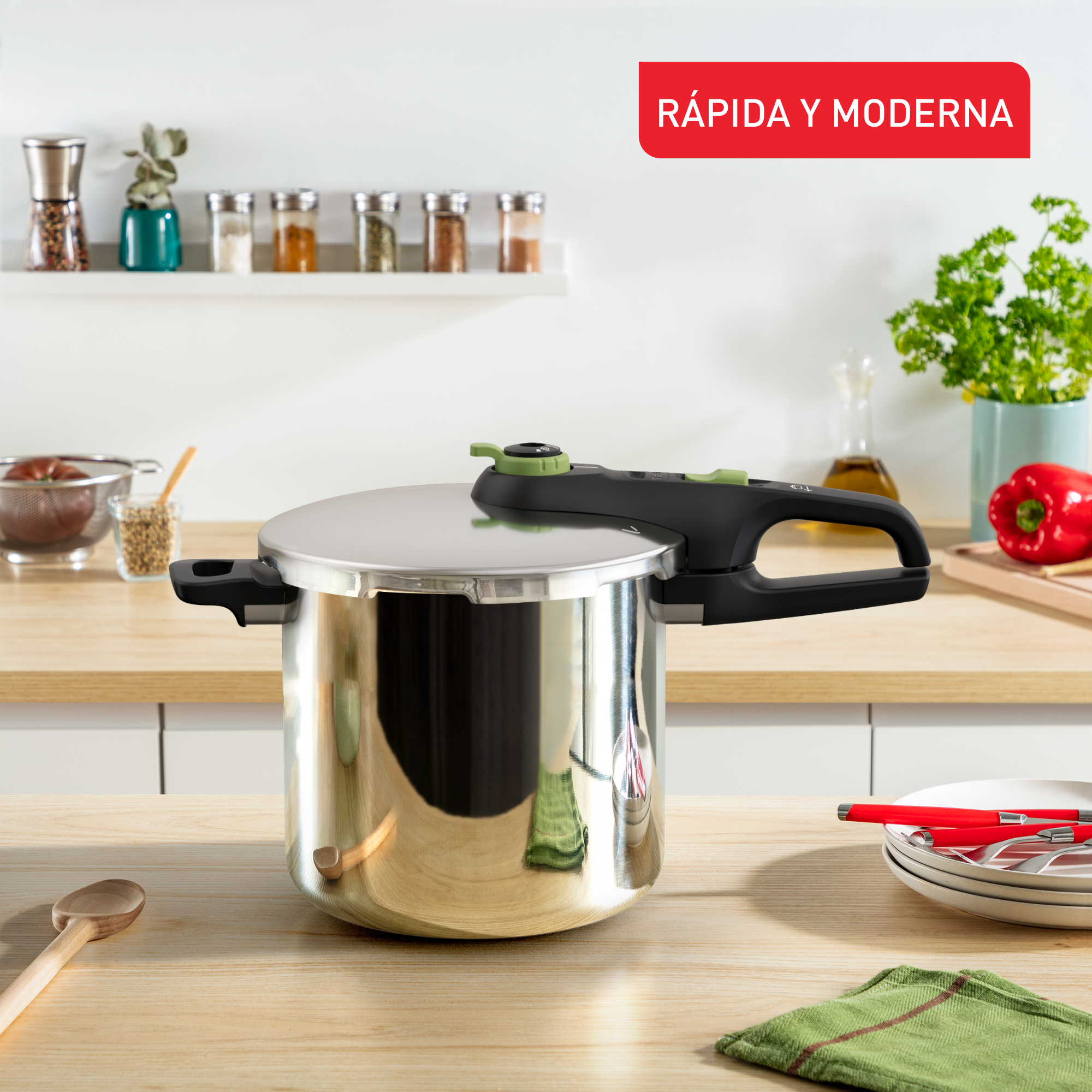 Olla a presión sobre mesa de madera con ingredientes y texto superpuesto. Dice 'Rapida y Moderna'.
