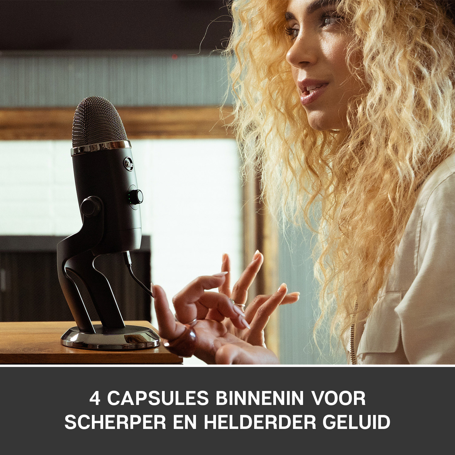 Woman speaking into a black microphone. Text at the bottom says: 4 CAPSULES INSIDE.