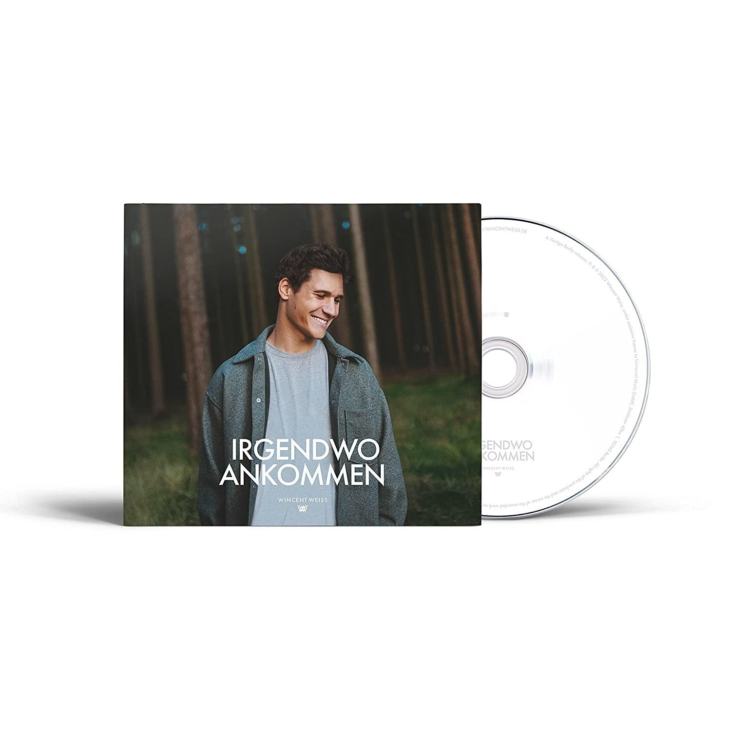 Eine CD und ein Albumcover eines lächelnden Mannes.