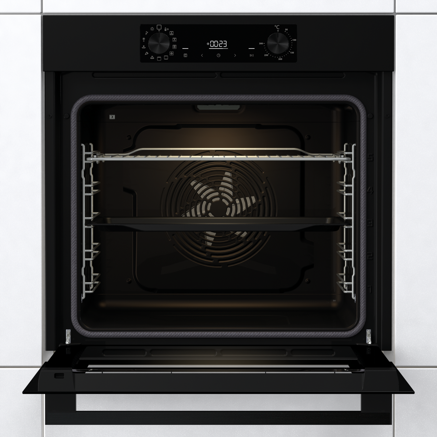 Oven interior with open door. Interior shows racks, fan, and a tray. Black and white tiles visible.