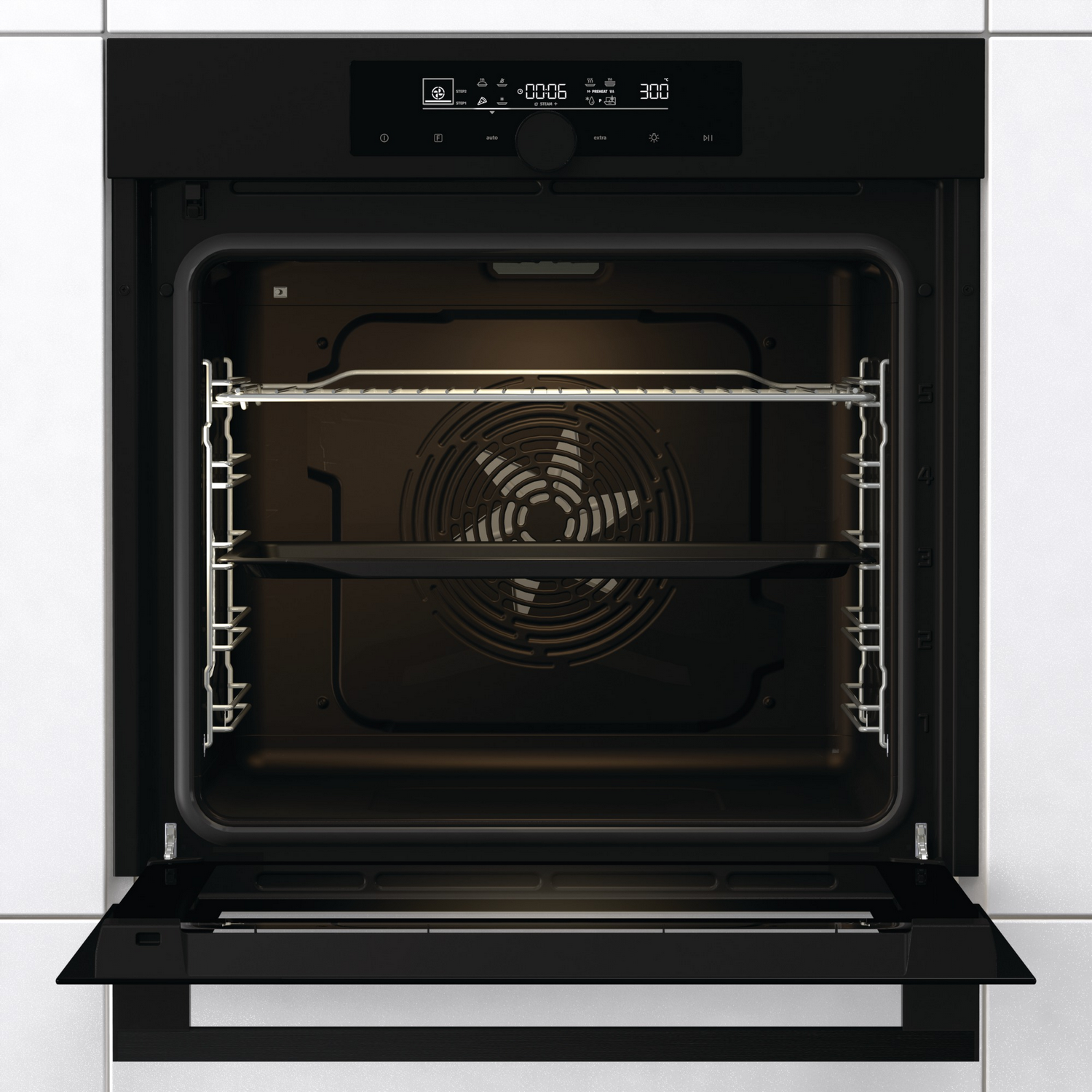An open oven with a fan and racks inside. The screen shows the time and temperature.