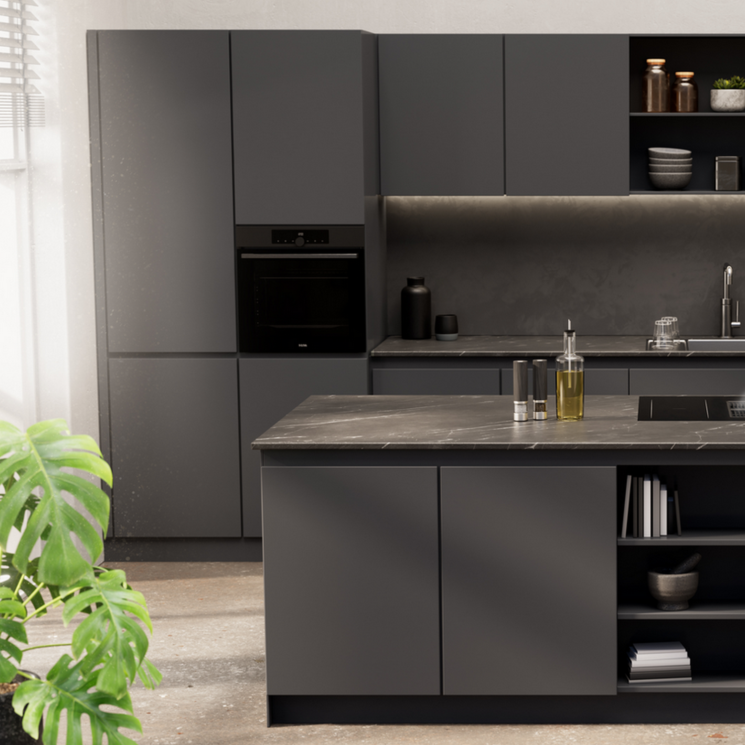 A modern kitchen with gray cabinets, a black oven, and a dark gray island with a granite top.