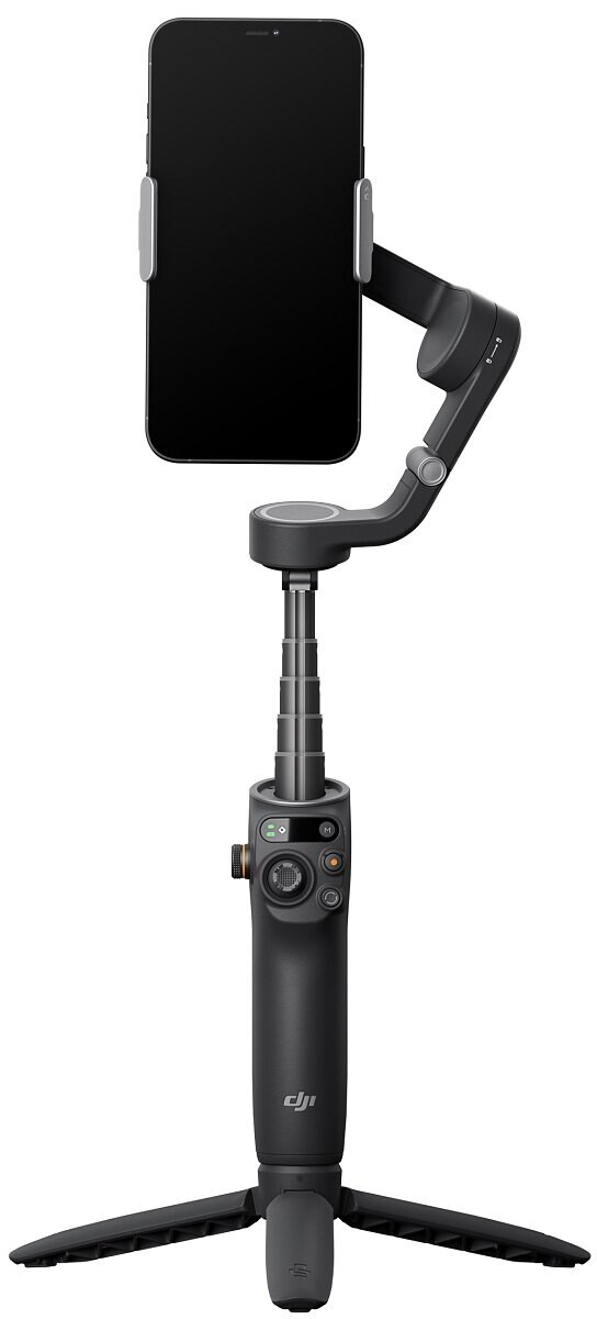 Czarny stabilizator do smartfona z dołączonym telefonem, na statywie. Widoczne przyciski i pokrętło.