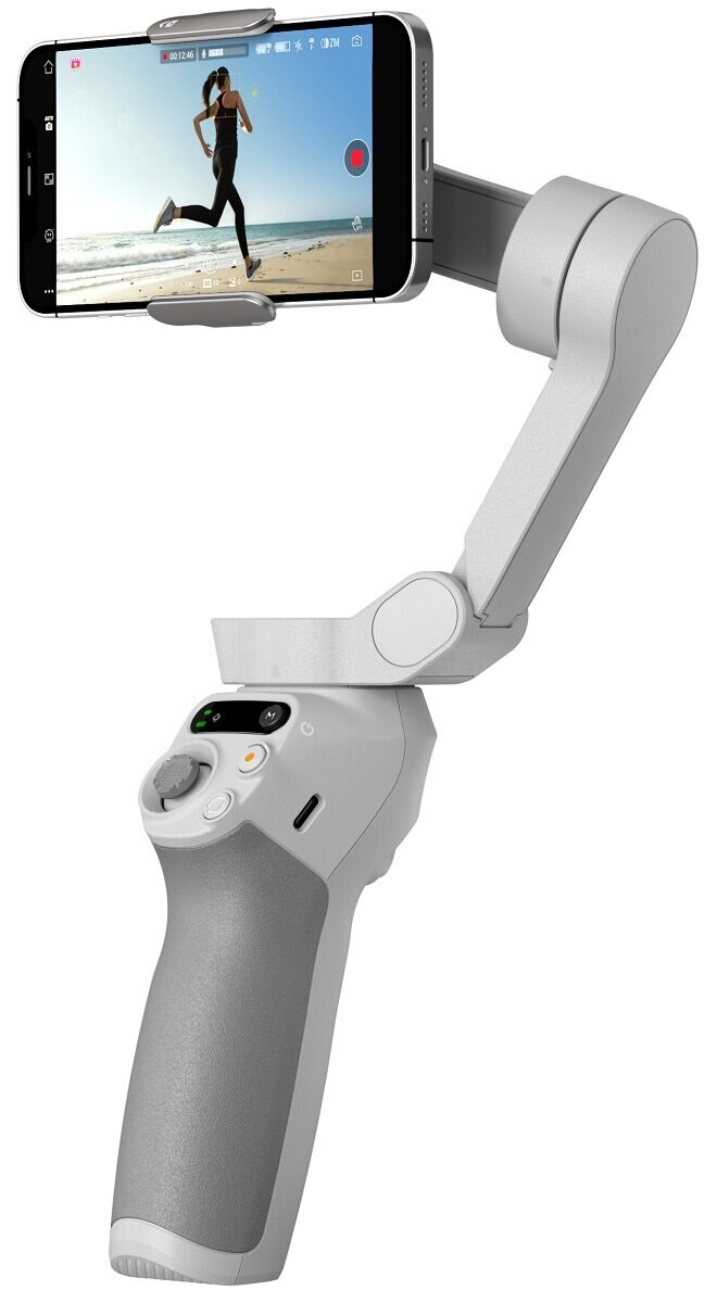 Biały gimbal z dołączonym smartfonem, na którym widać biegającą kobietę.