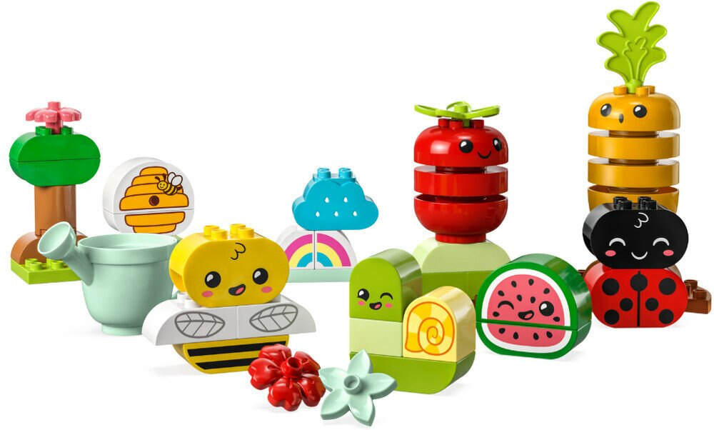 Zestaw zabawek warzyw i owadów wykonanych z kolorowych klocków.