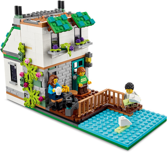 Scena z domu Lego. Są trzy minifigurki, mały basen i dom.