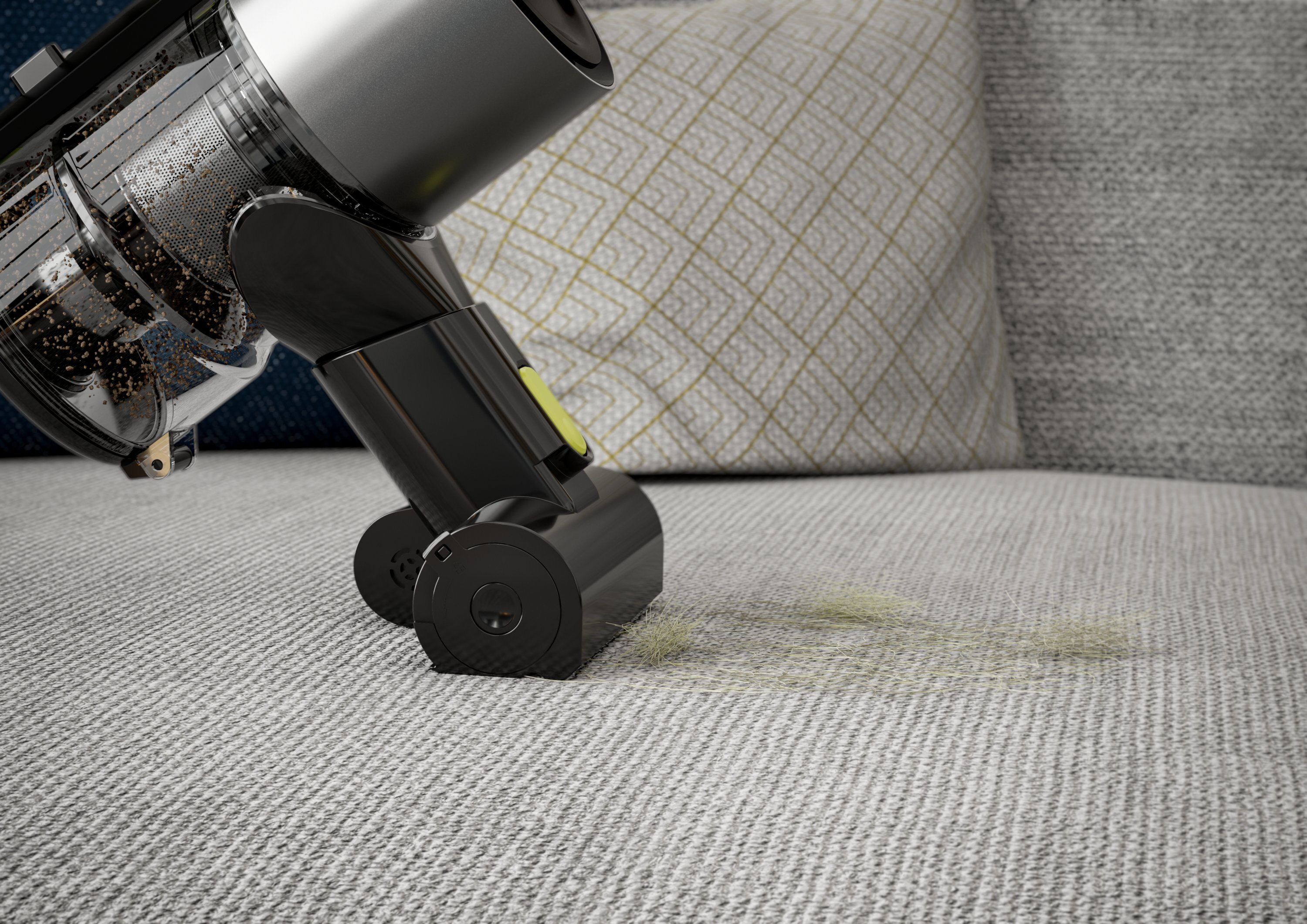 Odkurzacz czyszczący jasno szary dywan. Pokazuje szczotkę i trochę zanieczyszczeń.