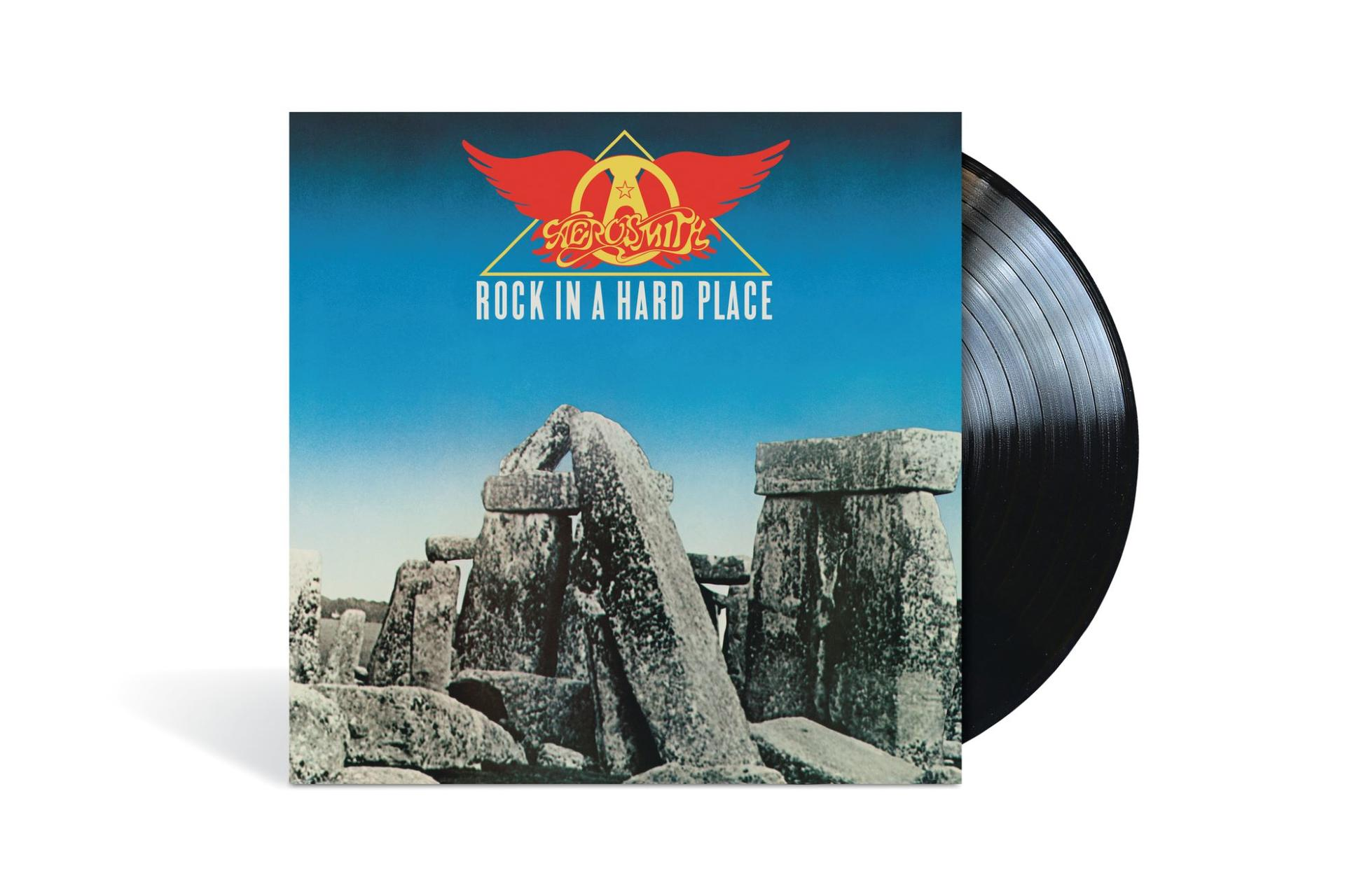 Az Aerosmith 'Rock in a Hard Place' című albumának bakelitje, kék égbolttal és fehér háttérrel.