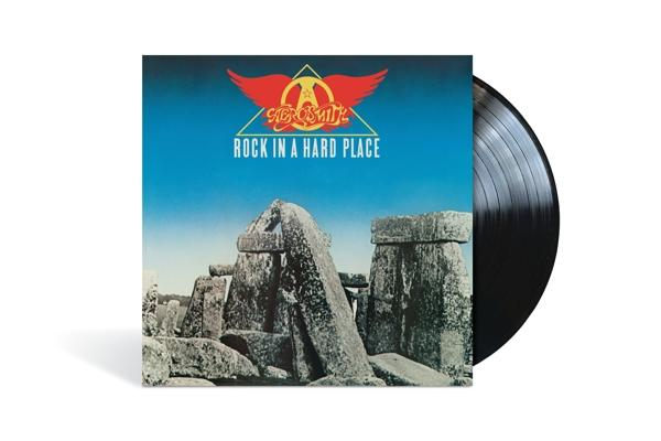 Aerosmith album borítója, fekete bakelit lemez. A borító egy kő struktúrát mutat kék ​​éggel.