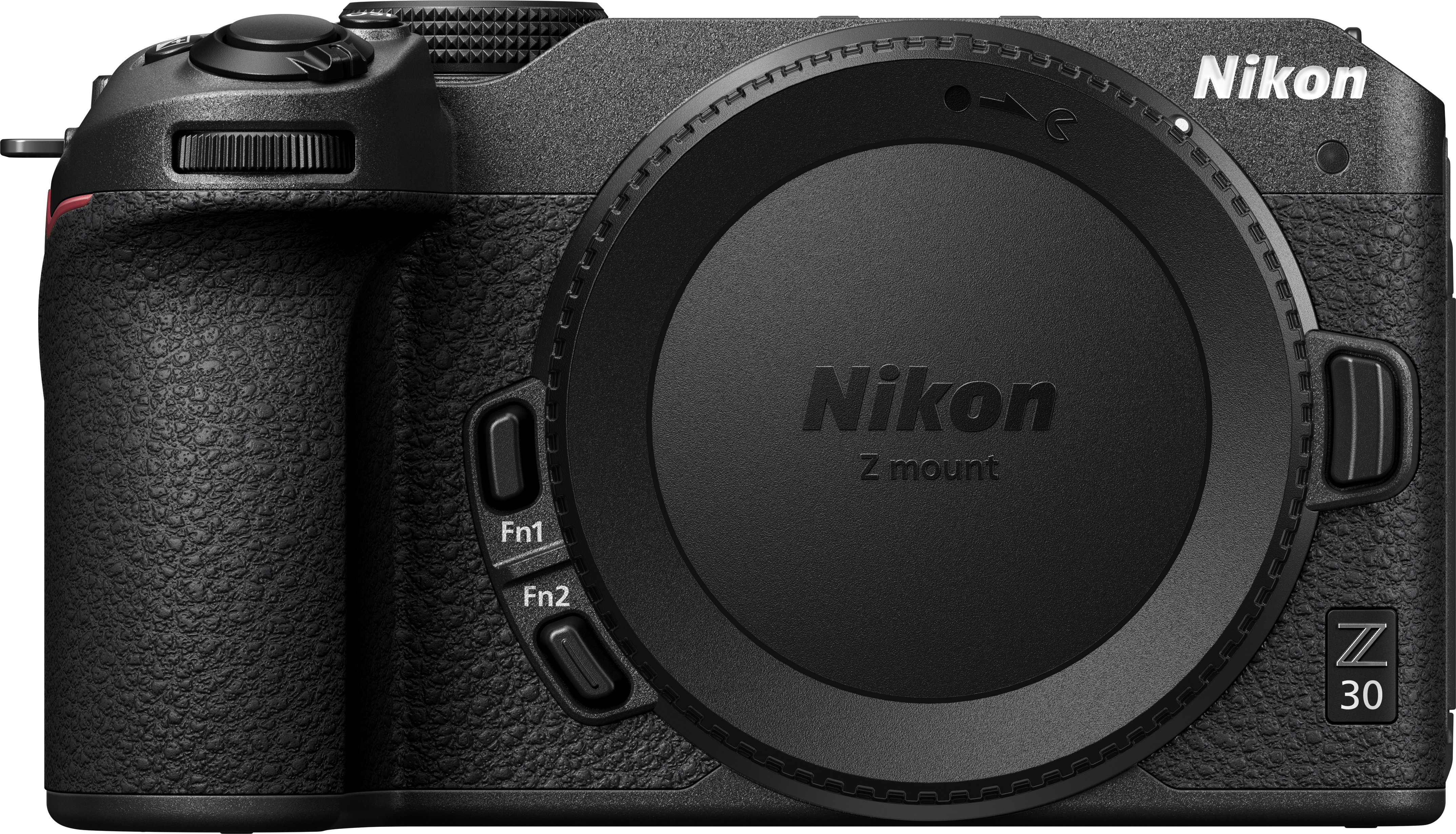 Un appareil photo noir Nikon Z 30 avec un bouchon d'objectif. L'appareil photo est sur une surface blanche.