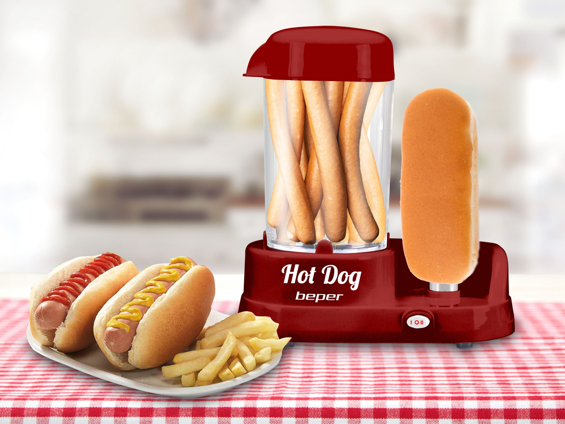 Egy piros hotdog készítő hotdogokkal, zsemlékkel és sült krumplival az asztalon.