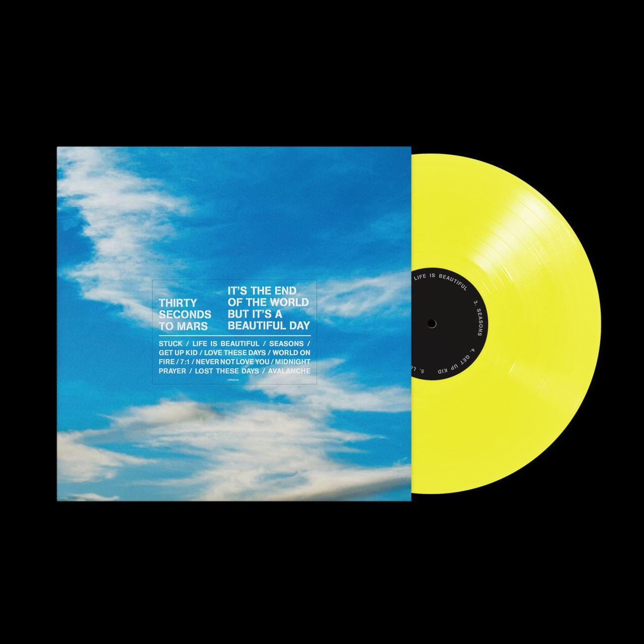 Gelbe Vinyl-Schallplatte mit blauem Himmel und Wolken-Albumcover.
