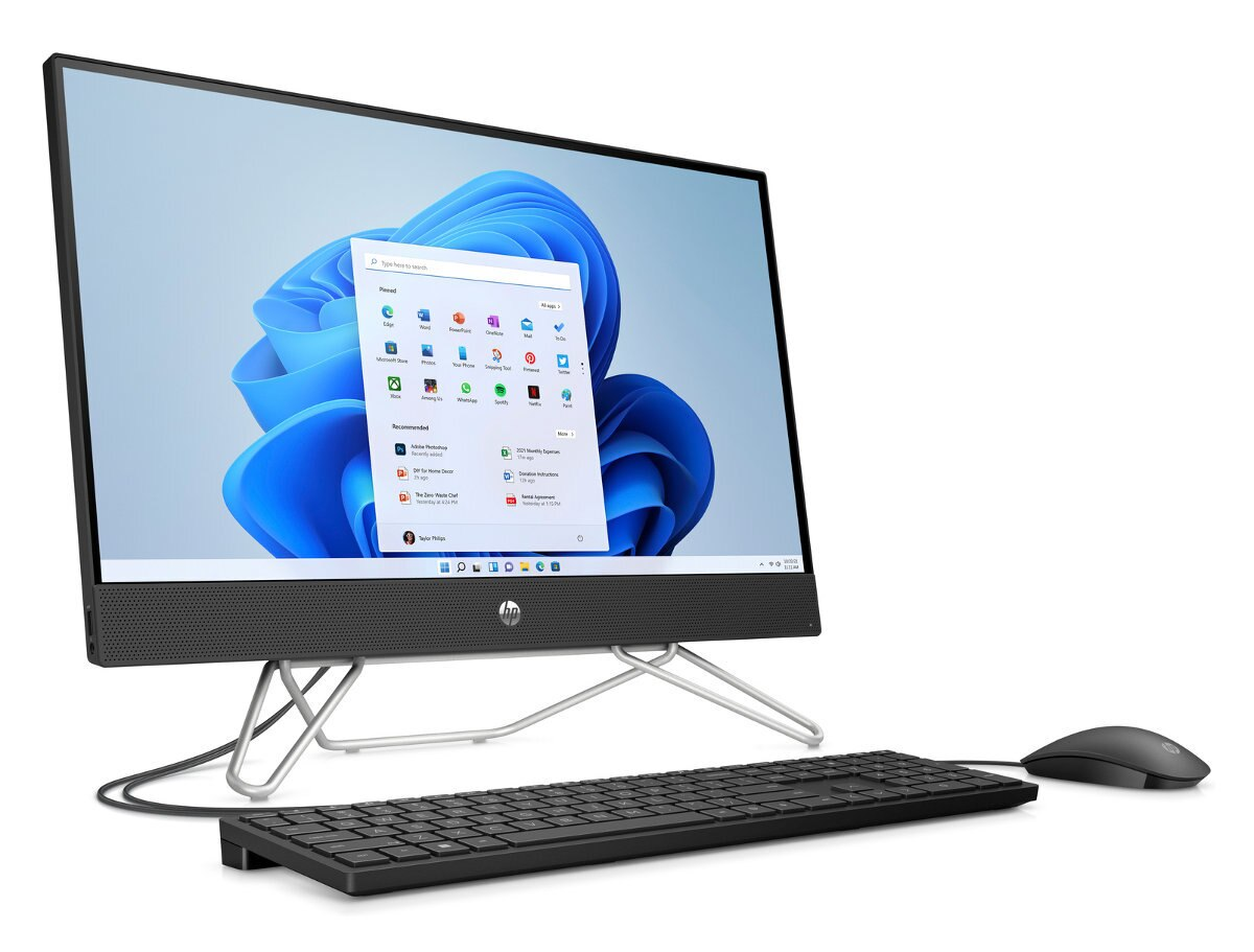Komputer HP all-in-one z klawiaturą, myszą i jasnym ekranem.