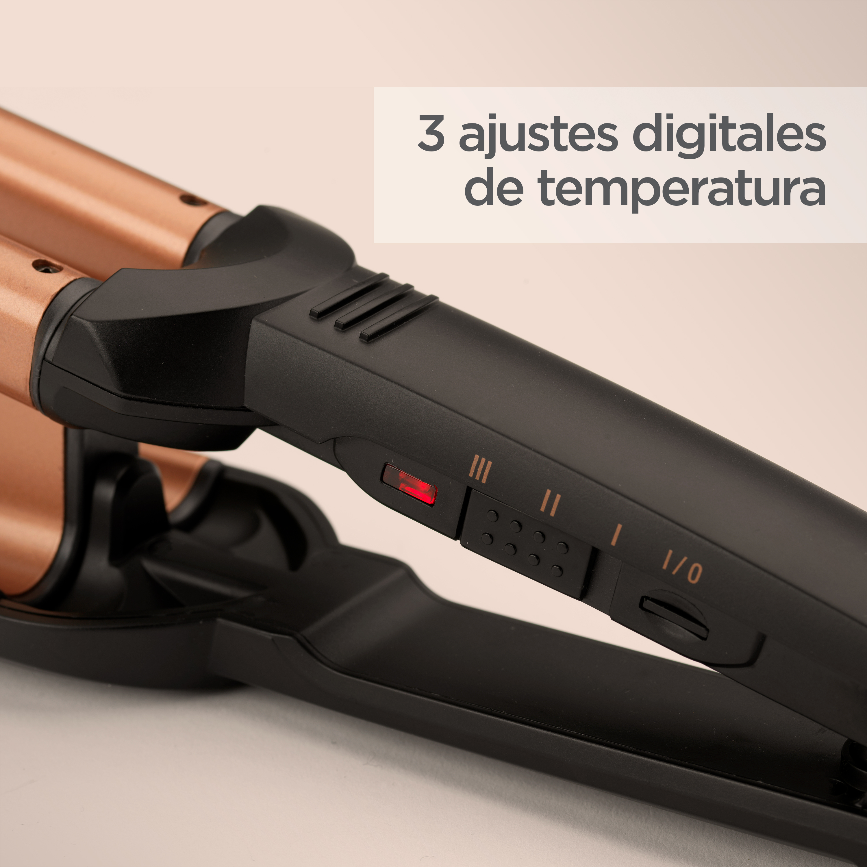 Rizador de pelo negro y bronce con tres ajustes de temperatura.