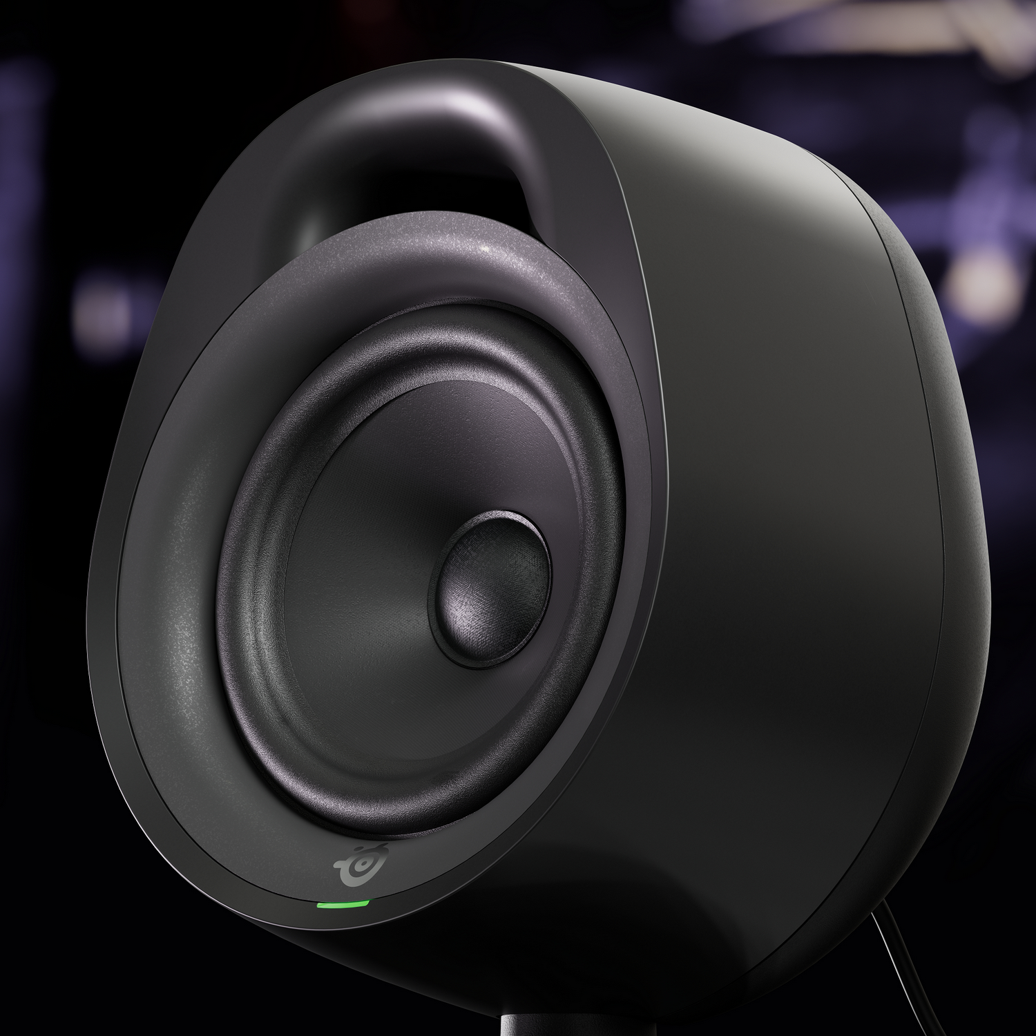 Black SteelSeries speaker with a rounded design, front-facing speaker and logo.