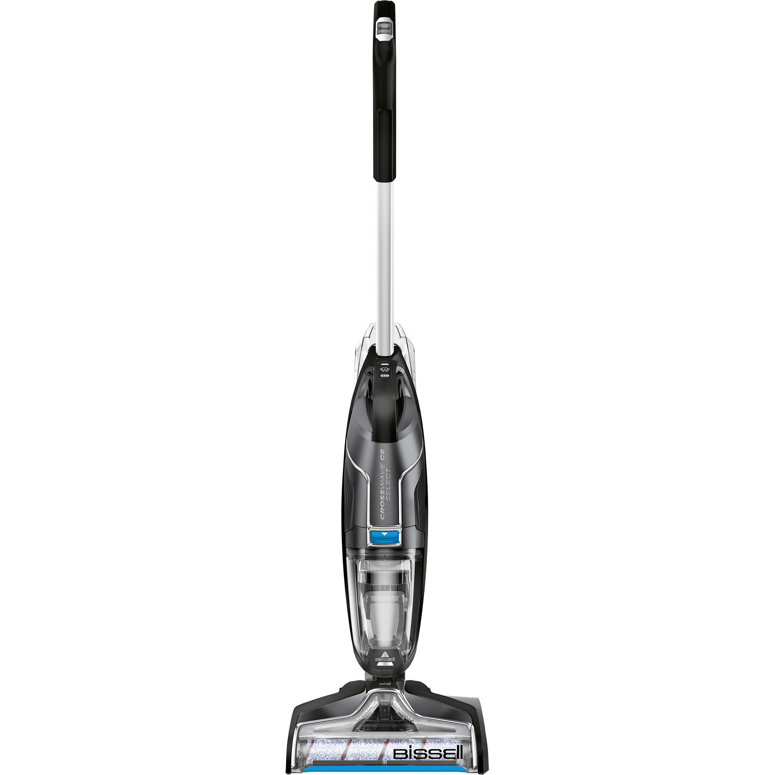 Ein kabelloser Staubsauger. Weißes und schwarzes Gehäuse, mit einem Sockel und einem langen Griff.
