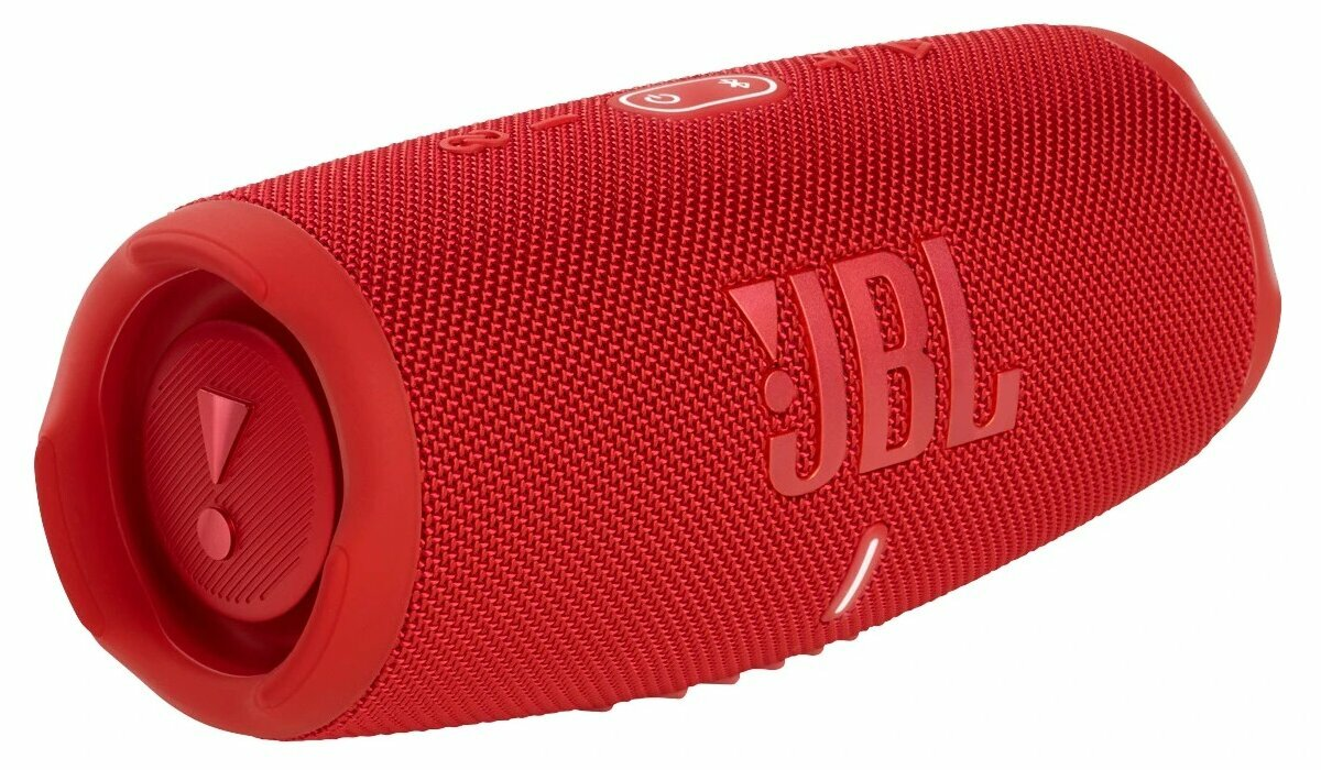 Czerwony głośnik JBL. Widoczne przyciski i logo. Kształt cylindryczny.