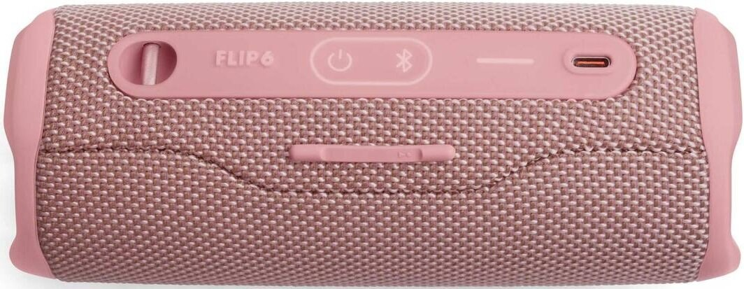 Różowy głośnik JBL Flip 6 z przyciskami. Różowy korpus i siateczkowa tkanina, etykiety JBL i Flip 6.