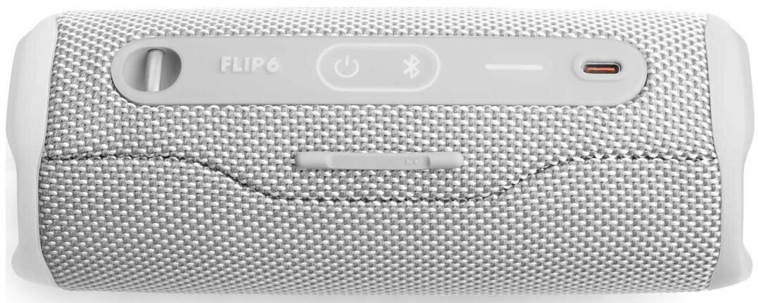 Biało-szary głośnik JBL Flip 6. Przyciski i porty na górze. Białe tło.